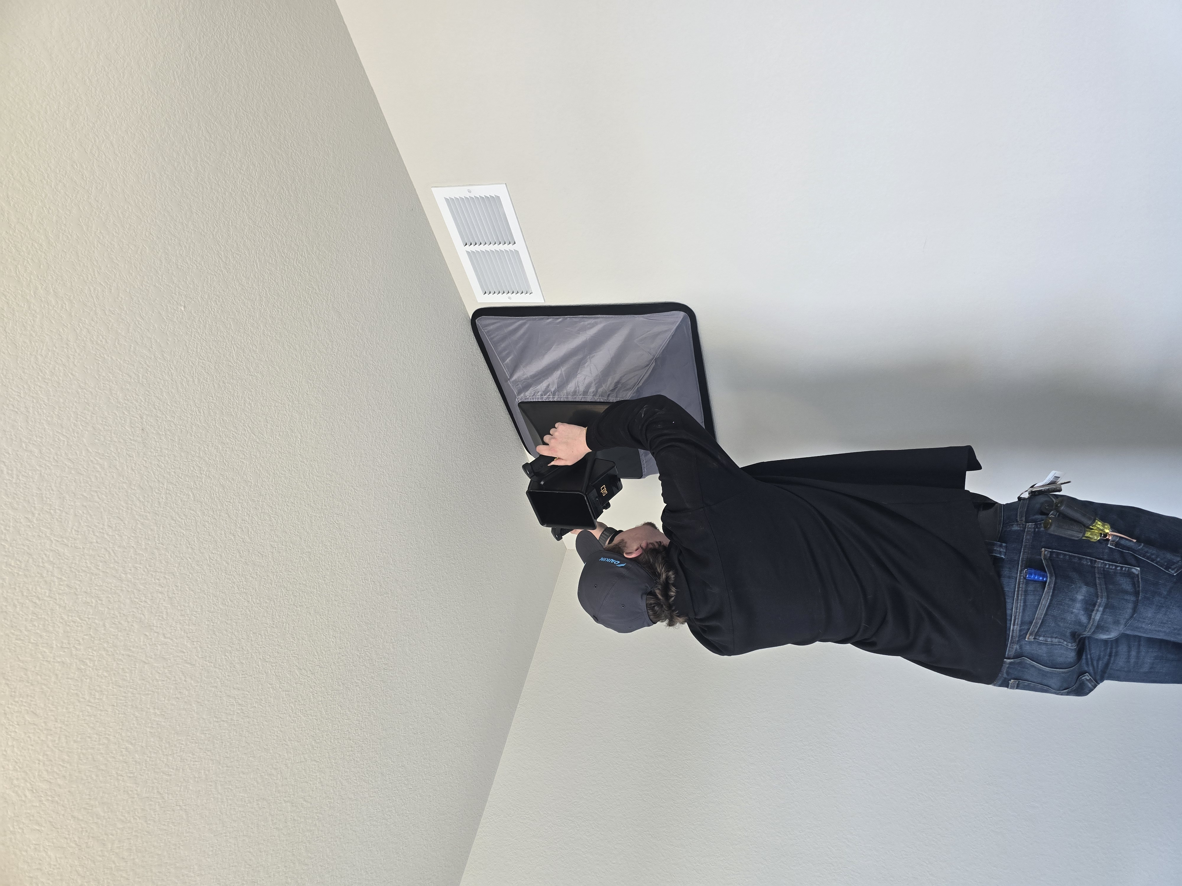 Measuring a supply register with a flow capture hood, measureQuick displaying the live CFM reading